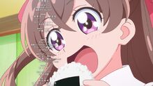 Yui eats a rice ball