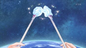 Mirai and Riko tap their wands