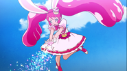 Cure Whip usando su ataque "Brilla, Brilla☆Brillante Kirakiraru☆" contra Akainu