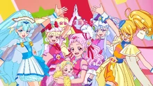 All five Cures plus Hugtan and Harry pose as the song ends