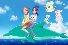 The Splash Star Cures on their way to the carnival by riding on a dolphin