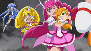 Las Pretty Cure saltan esquivando el ataque de Bad End Happy