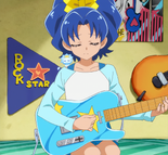 Aoi playing her electric guitar with her crystal lion on her shoulder