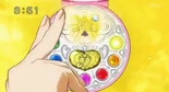 Yayoi inserts her Cure Decor into her Smile Pact