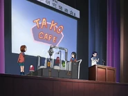 Nonomiya on stage when the presentation starts to malfunction.