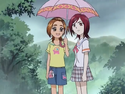 Saki and Michiru under the same umbrella