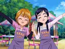 Honoka and Nagisa wearing the Tako Café uniform in episode 12