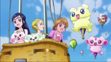 The Max Heart Cures on their way to the carnival by riding on a balloon in the second trailer