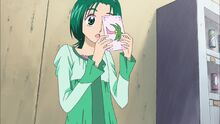 Komachi holds a letter