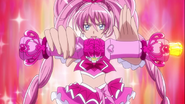 Melody a punto de usar el "Rondó Musical" en el ataque grupal "Combinación Especial del Cuarteto Rosado Pretty Cure"