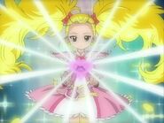 PCMH05.jpg (131 kB) Shiny Luminosa sosteniendo la silueta en su transformación