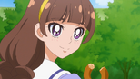 Kirara smiles whilst holding donut