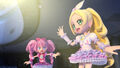 Cure Doll Rhythm waving at the bigscreen