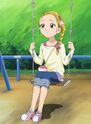 Hikari sitting on a swing