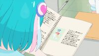 Lala flips through Hikaru's homework assignment