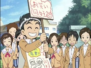 FwPCSS16 - Kenta recruits.jpg (293 KB) What seems to be a rough drawing of Nitta on the signboard Kenta wears.