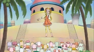 Urara on the stage in the Palmier Kingdom