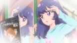 Karin checking out her hair in the mirror