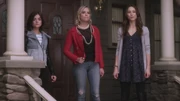 Aria, Hanna and Spencer talk to a cop watching the DiLaurentis household