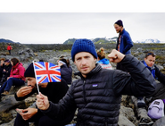 Julian holding a tiny flag