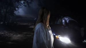 Alison looking at a now-dead Archer