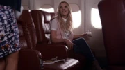 Hanna on a plane back to Rosewood from New York