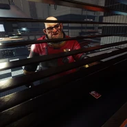 Luka passing Morgan Will Mitchell's cabin keycard.