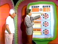 ...and go into the give column for a total of $82. He keeps the spice rack, slow cooker, and cosmetics no matter what, but if they total $82 or more, he wins those bars of gold.