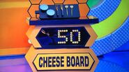 He bids $50 on the 7pc cheese board set and is exactly right! And, he automatically wins the $40 can opener and the gardening tool set. He picks cards #10, #30, and #11.