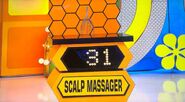 She bids $12 on the wire scalp massager. A difference of $19. She gets no card.
