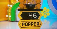 He bids $35 on the popcorn popper with a difference of $11. He gets no card.