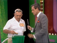 During Wayne's third draw, a number and a strike were pulled out at the same time. So Bob putted them both back in the bag.
