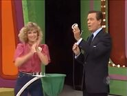 Teri's ninth draw is a 6. She wins the Pontiac 2000 Sunbird coupe!