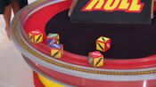 On her first roll, she has 1 car and $3,500. She decides to roll again.