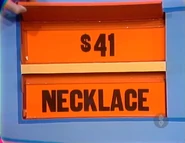 He keeps the necklace. The toaster is $41 and goes into the give column.