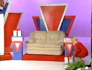 Her second clue is to eliminate the prize that starts with a 9. She picks the love seat.