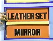 The next two prizes are a mirror and a leather set.