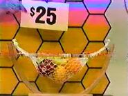 He bids $20 on the fruit hammock. A difference of $5. He picks card #23.