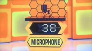 He bids $35 on the FIFINE USB microphone. A difference of $3. He picks card #30.