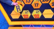 It's an R. $2,000 is now up for grabs, but the contestant decides to go for the car.