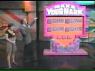 Make Your Mark played on The New Price is Right, with host Doug Davidson. (Notice that the Make Your Mark Sign is covering Barker's Markers.)