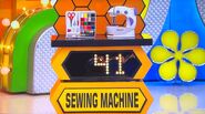 She bids $55 on the Magicfly sewing machine. A difference of $14. She gets no card.