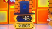 She bids $45 on the paper shredder. A difference of $1. She picks card #27.