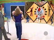 The contestant has missed her first throw.