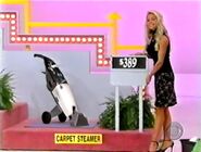 First, she picks the carpet steamer.