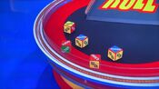 On his first roll, he has 1 dollar sign and $25,000. He decides to roll again.