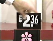Next, she picks the Coricidin which is $2.36.
