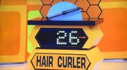 She bids $40 on the Conair curling iron. A difference of $14. She gets no card.