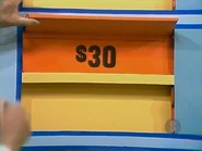 The camera is $30, giving the keep column a total of $67 thus far. If the jeans are $19 or more, she wins.