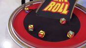 On his first roll, he has 3 cars and $2,000. He decides to roll again.